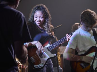 Short Courses - Summer Schools 2024 - Jazz & Rock Week - Participant playing Bass Guitar (Paul Cochrane)